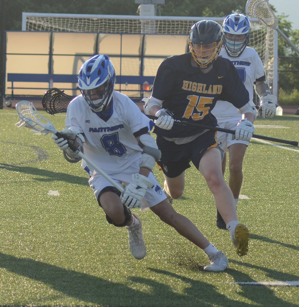 Wallkill’s Richie Martinez runs with the ball as Highland’s Aden Wider pursues during the Section 9 Class C boys’ lacrosse championship game on June 12, 2021, at Wallkill High School.